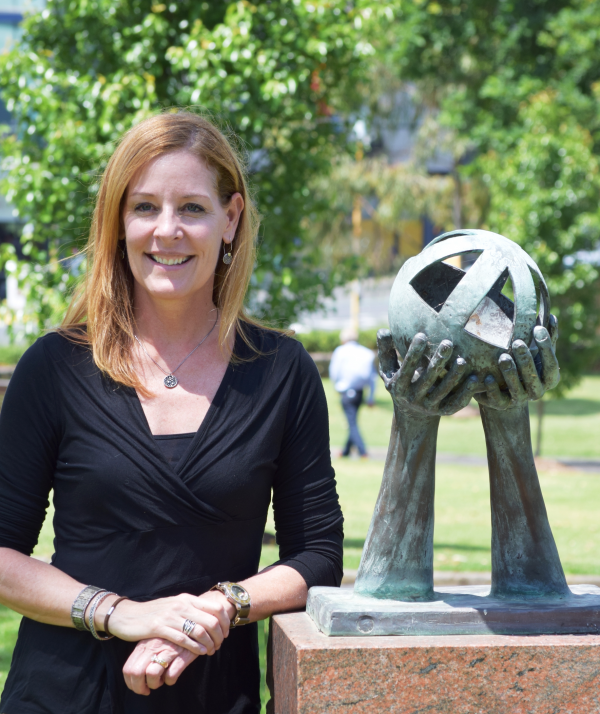 Kelly Clancy standing at the Thomas Ambrose Bowen monument in Geelong